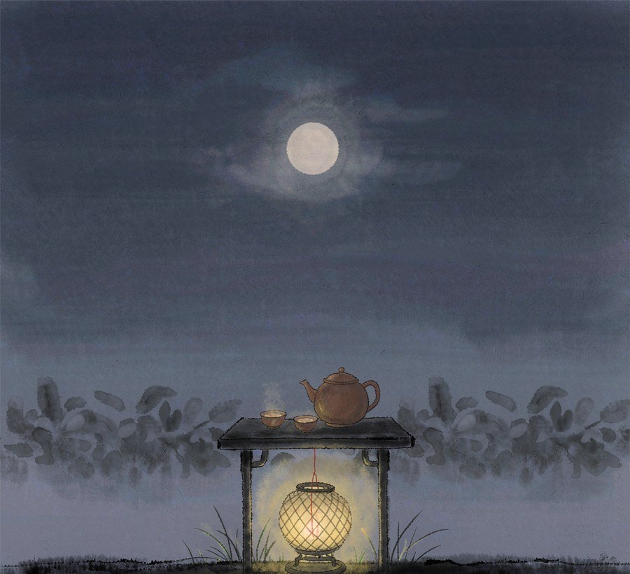 teapot and small cups beside a warm paper lantern at mid autumn night